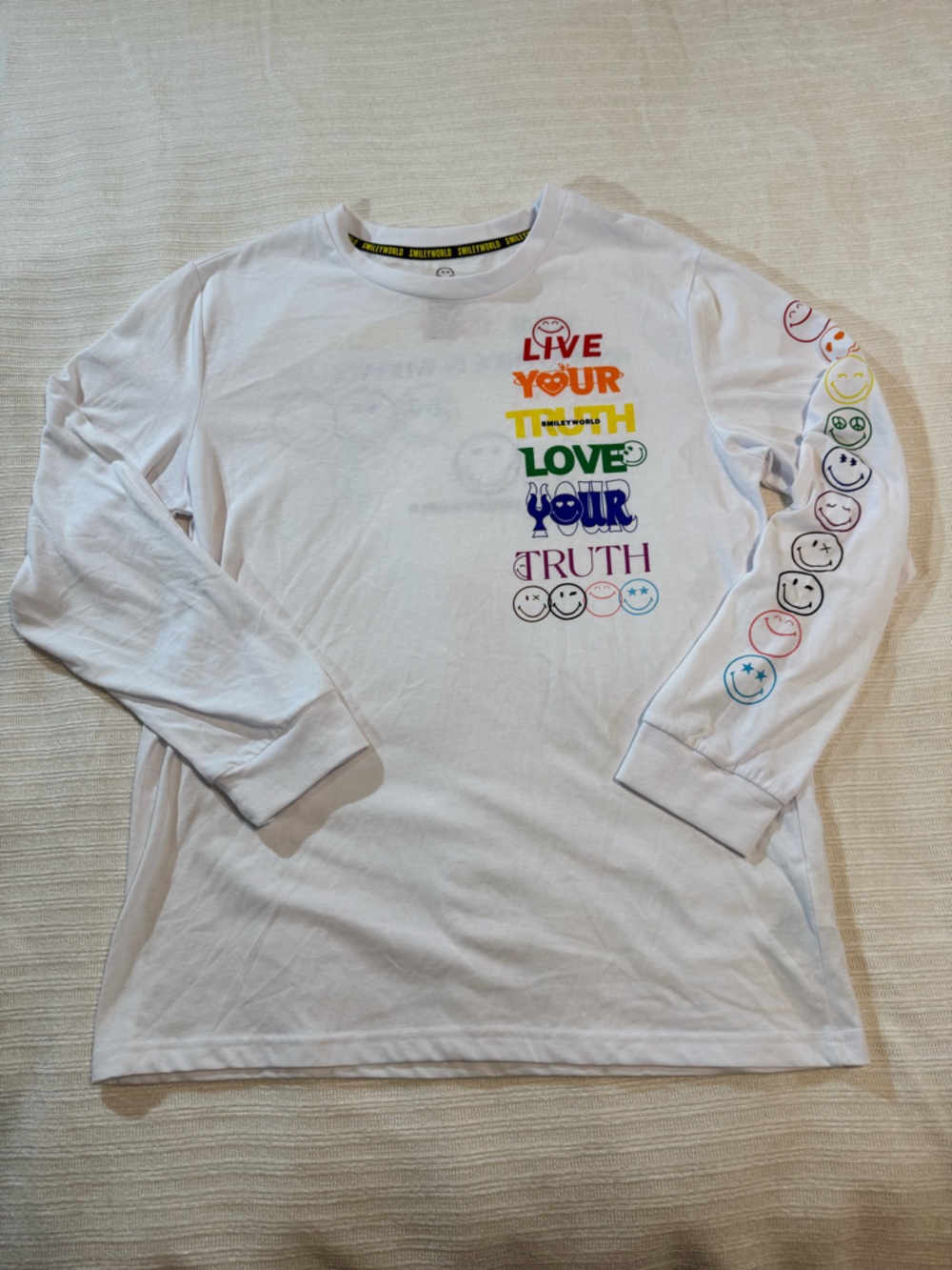 White Long-Sleeve Graphic Tee with Rainbow Text and Smiley Icons